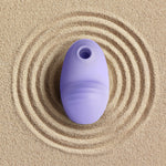 Clitoral vibrator and satisfyer suction Namii by Biird in purple in sand