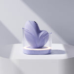 Clitoral vibrator and satisfyer suction Namii by Biird in purple in charge station