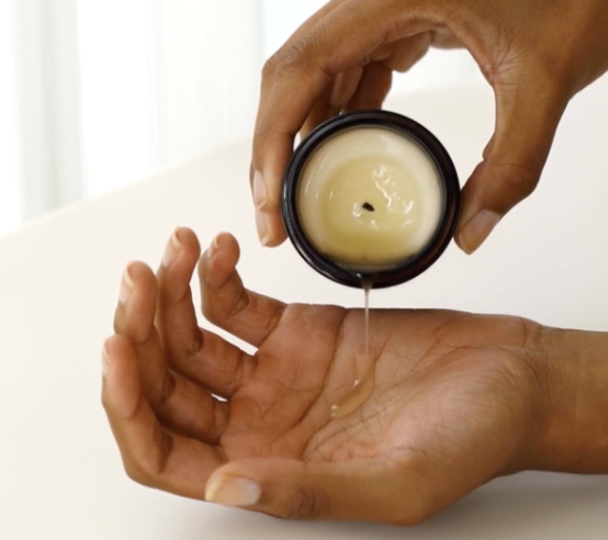 Wonderstate Sexual Wellness Burn Massage Candle by Maude with hand and massage