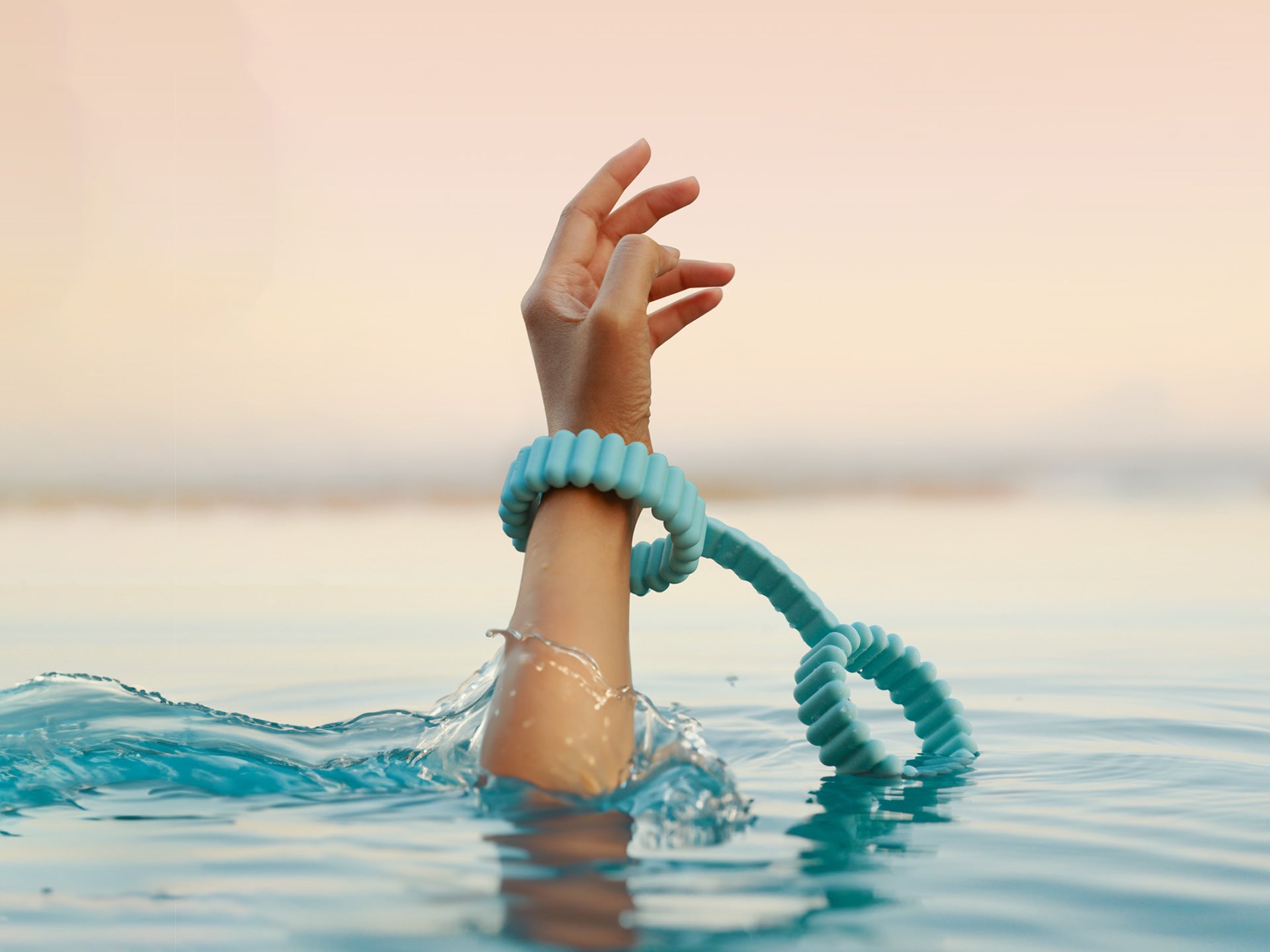 Playful Handcuffs for couples play by Biird in turquoise in water