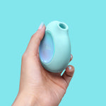 Lumii suction satisfyer vibrator by Biird mint with hand