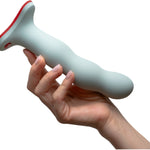 Wonderstate Sexual Wellness Fun Factory Bouncer Dildo in color sage with hand