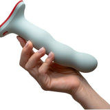 Wonderstate Sexual Wellness Fun Factory Bouncer Dildo in color sage with hand