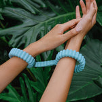 Playful Handcuffs for couples play by Biird in turquoise with leafy background